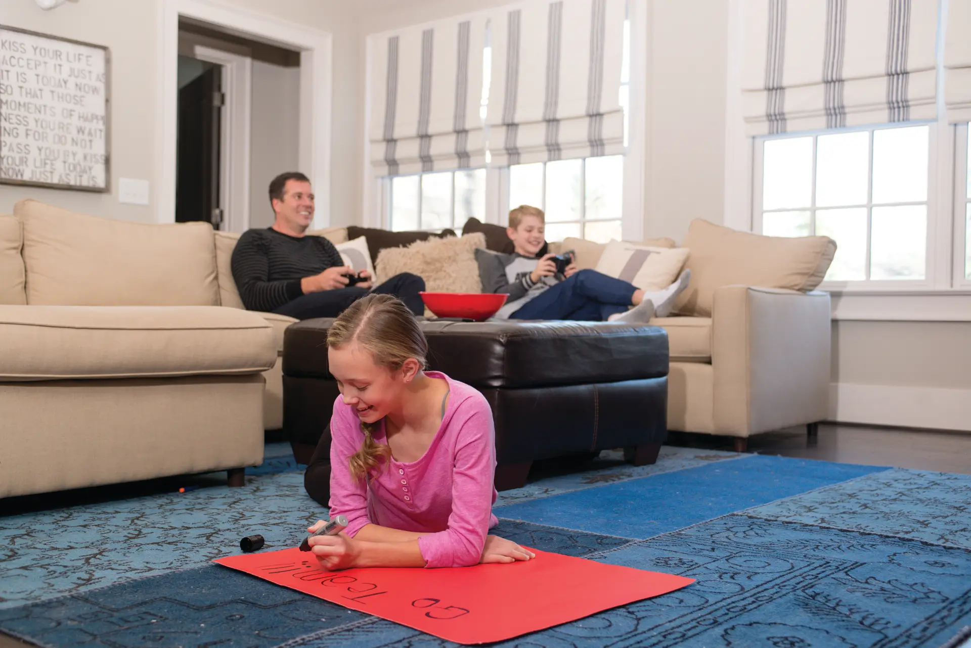 Family relaxing in their living room with a new heat pump system